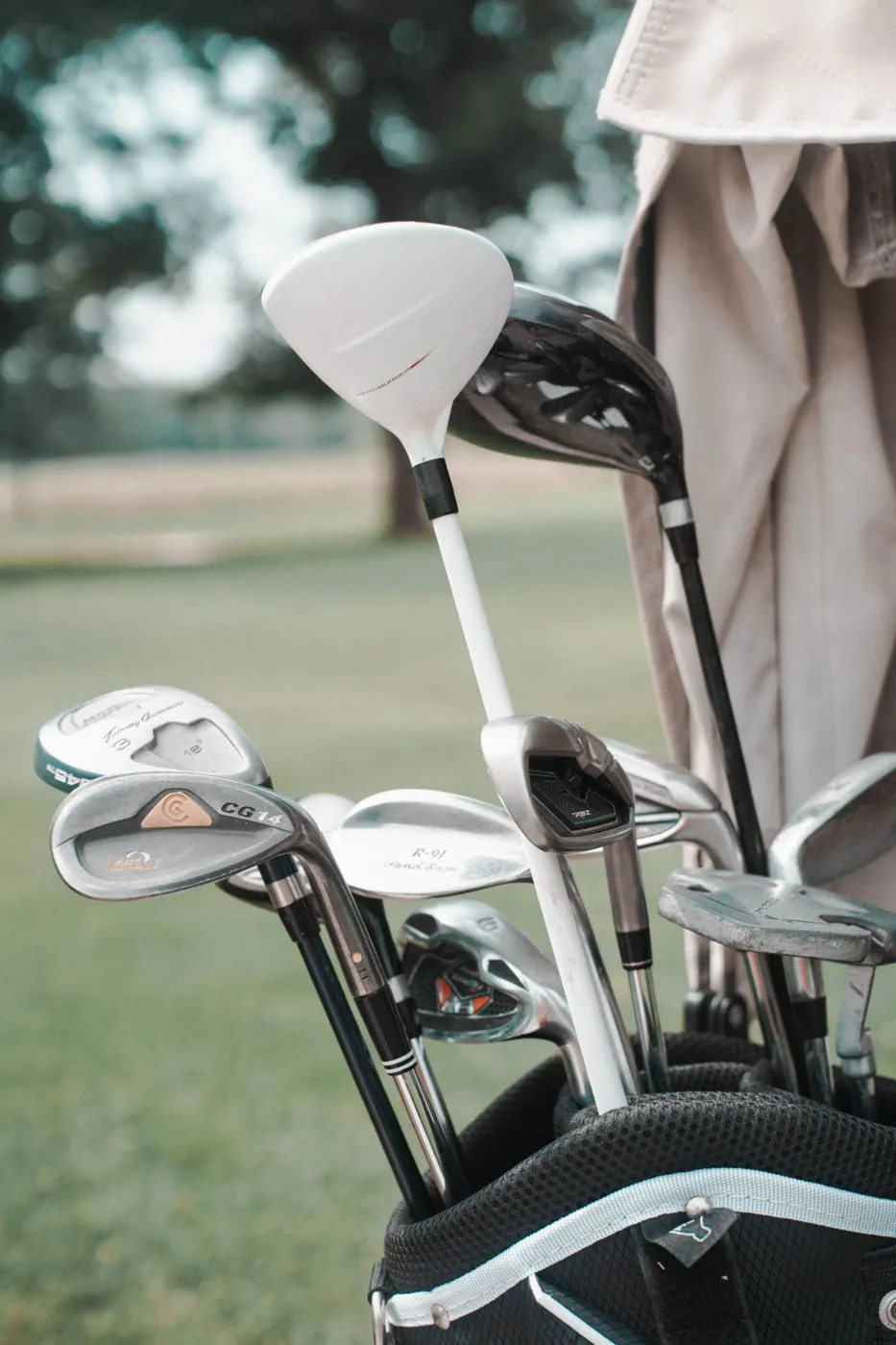 Golf clubs in a bag on the course