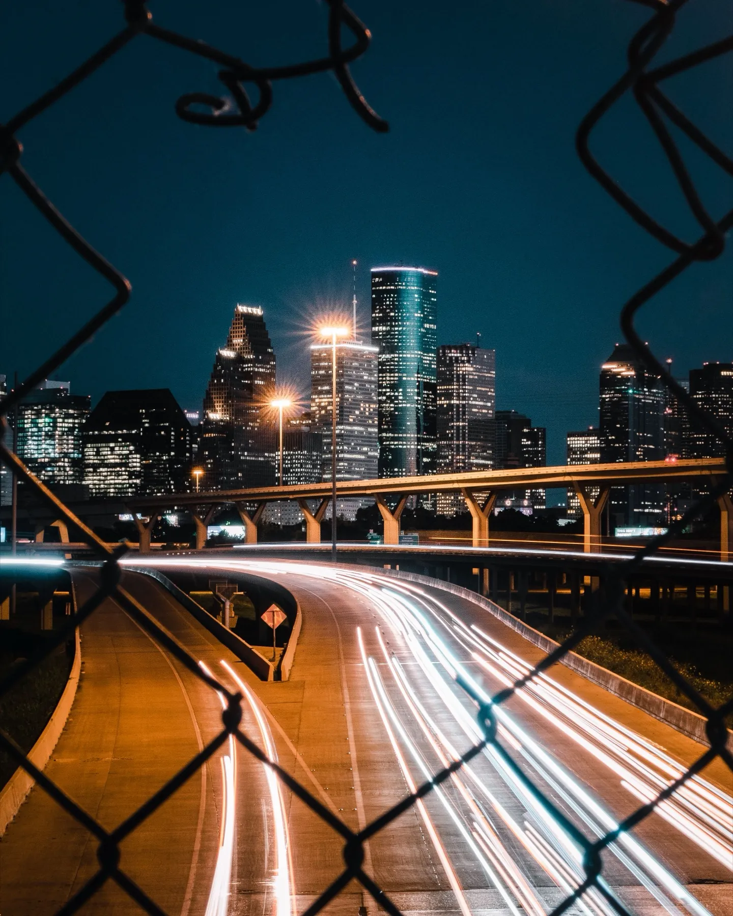 Houston skyline at night with light trails